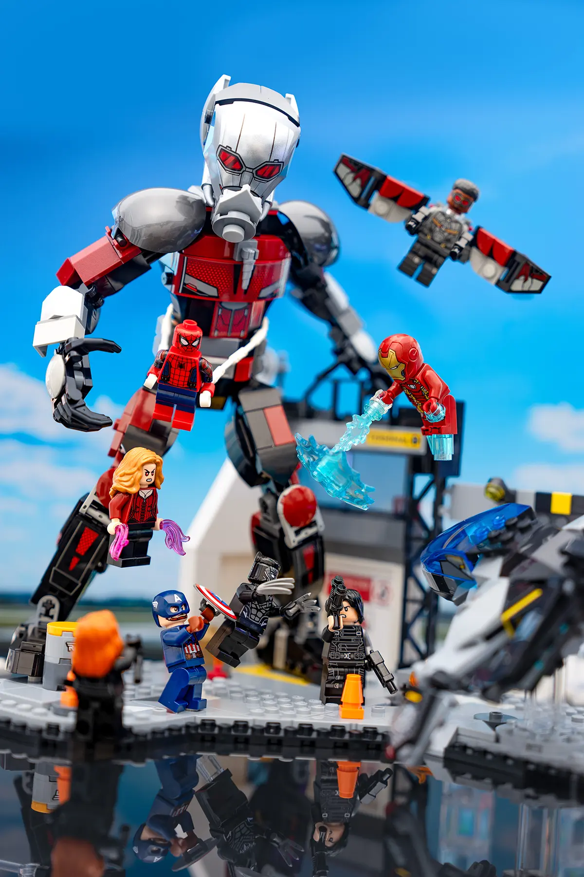 LEGO Marvel minifigures reenact the Civil War airport battle with Support bars removed. The image features clean cutouts, vivid lighting, and rich color grading that enhances the action and sky backdrop.