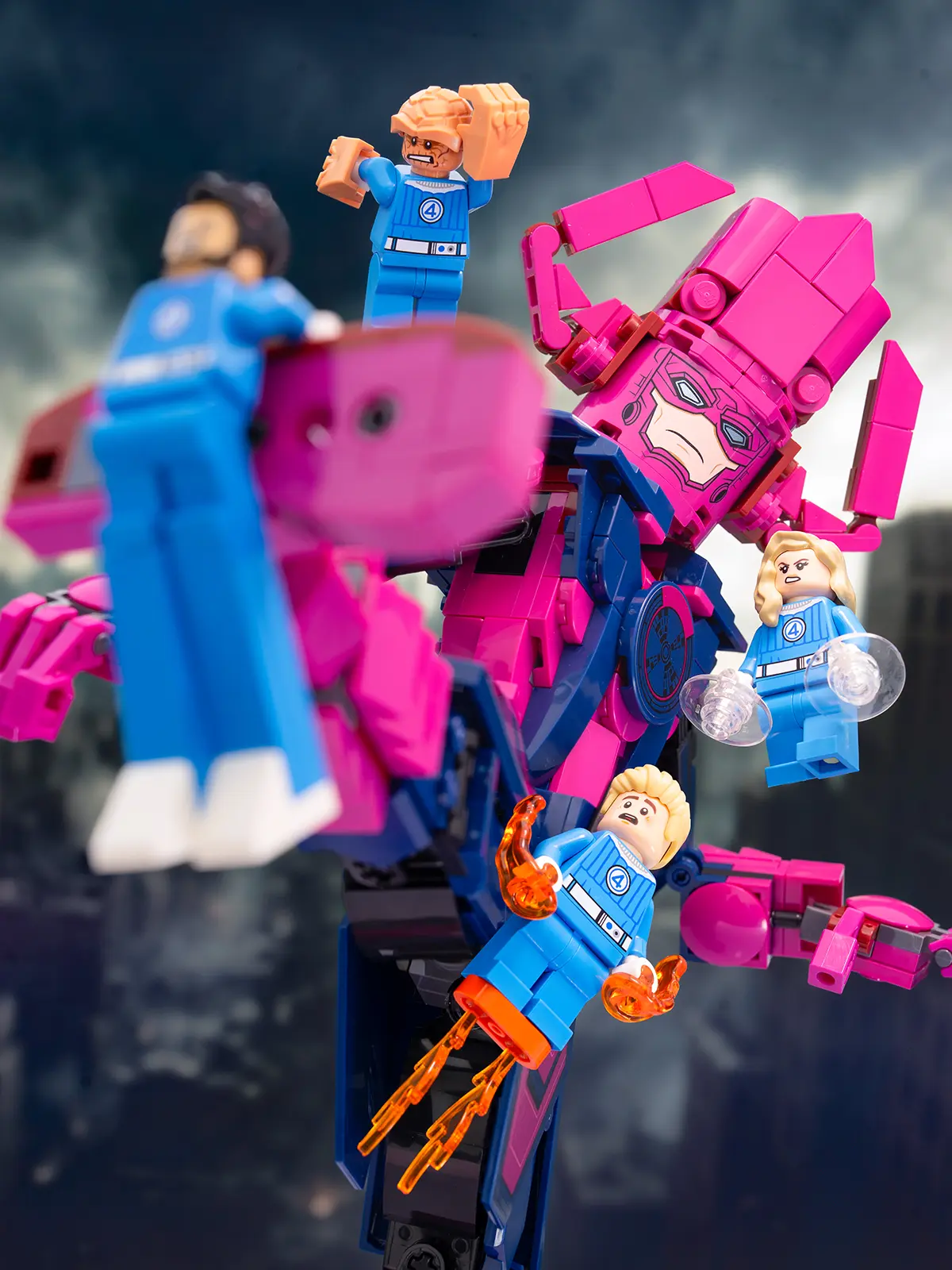 The Fantastic Four battle Galactus in a dramatic LEGO scene. All support structures have been removed, and enhanced lighting and contrast bring energy and focus to the characters against a moody sky.
